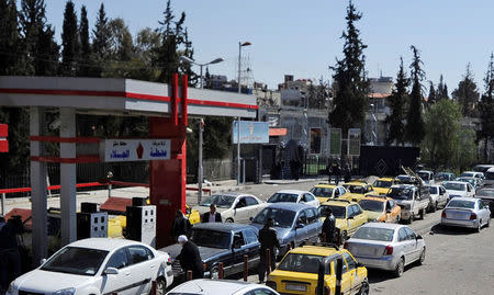 Vehicles queue for petrol at a gas station in Damascus, Syria , February 19, 2017. Picture taken February 19, 2017. REUTERS/Omar Sanadiki