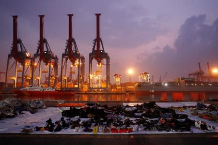 Recovered belongings believed to be from the crashed Lion Air flight JT610 are laid out at Tanjung Priok port in Jakarta