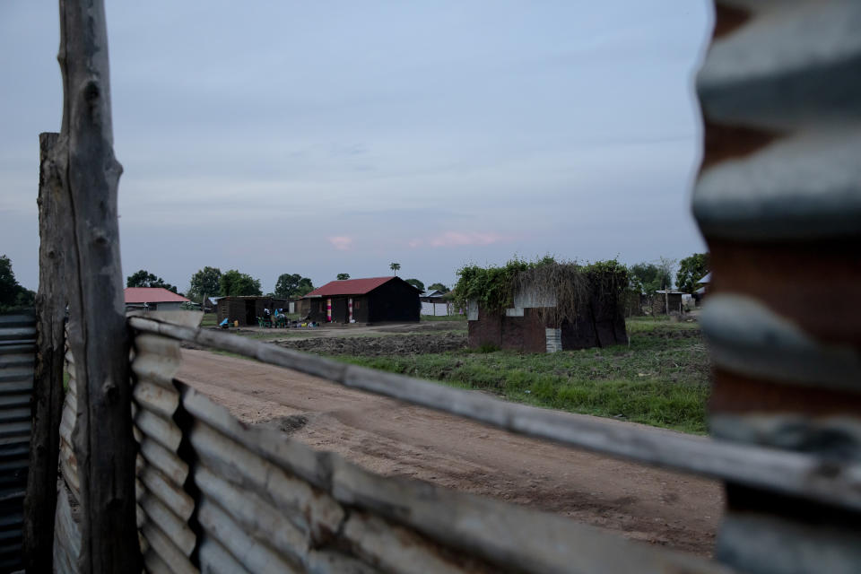 Paska Itwari Beda's house is said to be near mliitary barracks in Juba, South Sudan. Beda, now 27, delivered her youngest children, twin girls, just weeks before coronavirus arrived in Africa. Along with the closing of borders and other pandemic restrictions, prices began rising for basic items such as cooking oil. Schools closed, and the paychecks for teachers - including Beda's husband, who had long supported the family with his steady salary - abruptly stopped. (AP Photo/Adrienne Surprenant)