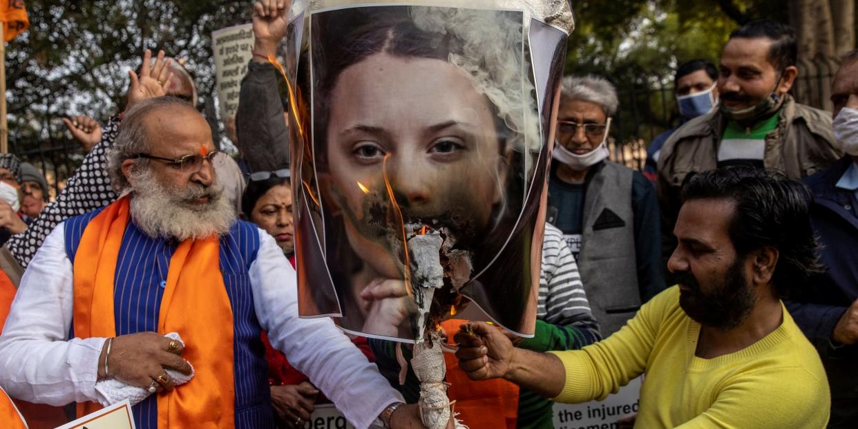 Activists from United Hindu Front burn an effigy depicting climate change activist Greta Thunberg to protest against the celebrities for commenting in support of protesting farmers, in New Delhi, India, February 4, 2021. REUTERS/Danish Siddiqui TPX IMAGES OF THE DAY