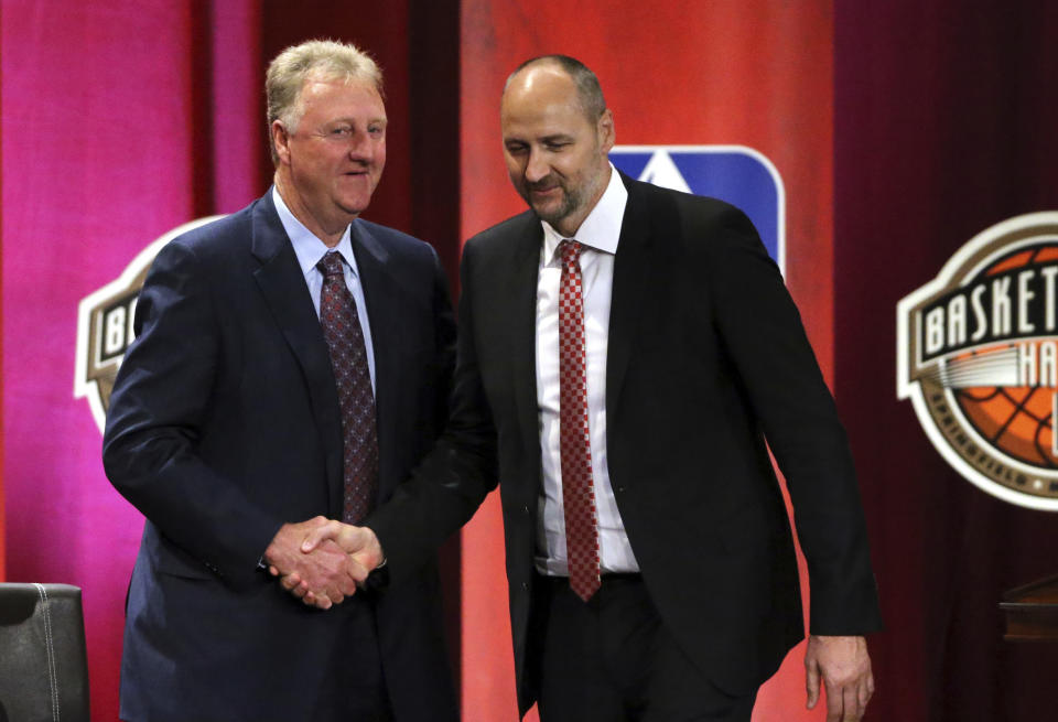 Dino Radja, right, shakes hands with Hall of Famer Larry Bird after speaking during induction ceremonies into the Basketball Hall of Fame, Friday, Sept. 7, 2018, in Springfield, Mass. (AP Photo/Elise Amendola)