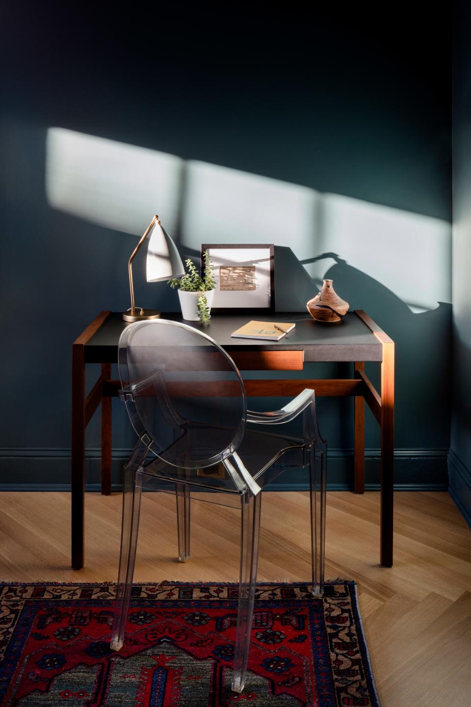 Jens Risom created the Design Within Reach desk, and the chair is by Philippe Starck for Kartell.