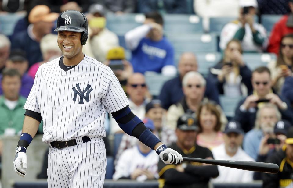 New York Yankees shortstop Derek Jeter smiles as he walks to the plate during the first inning of an exhibition baseball game against the Pittsburgh Pirates Thursday, Feb. 27, 2014, in Tampa, Fla. (AP Photo/Charlie Neibergall)