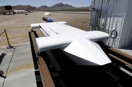 A man looks over a mock-up of a test sled following a propulsion open-air test at Hyperloop One in North Las Vegas, Nevada, U.S. May 11, 2016. REUTERS/Steve Marcus