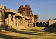 The ruins of the Achyuta Raya temple look so serene and beautiful that one can only wonder how grand the temple must have looked 500 years ago. It rests at the foot of the Matanga hill. This is the pillared 'Mahamantapa' and two of the three 'Mahadwaras' in the temple complex.<br><br>