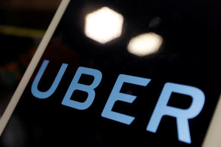 The logo of Uber is seen on an iPad, during a news conference to announce Uber resumes ride-hailing service, in Taipei, Taiwan April 13, 2017. REUTERS/Tyrone Siu