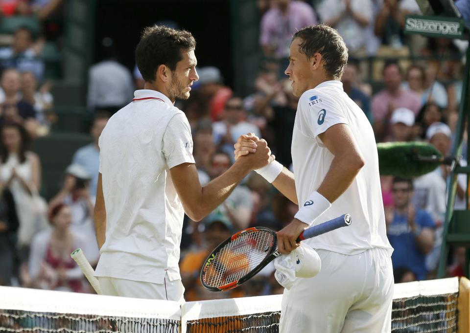 Pospisil and Ward shake, when it was all said and done.  (REUTERS/Stefan Wermuth)