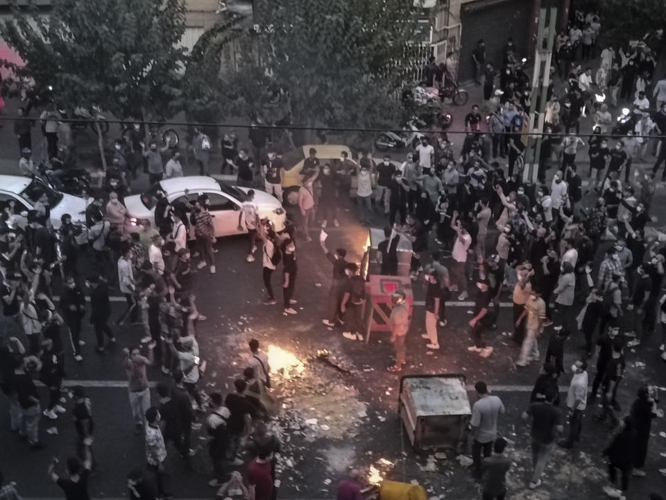 FILE - Iranians protest a 22-year-old woman Mahsa Amini's death after she was detained by the morality police, in Tehran, Sept. 20, 2022, in this photo taken by an individual not employed by the Associated Press and obtained by the AP outside Iran. Iran’s atomic energy agency alleged Sunday, Oct. 23, 2022, that hackers acting on behalf of an unidentified foreign country broke into a subsidiary’s network and had free access to its email system. Sunday's hack comes as Iran continues to face nationwide unrest first sparked by the Sept. 16 death of Amini. (AP Photo/Middle East Images, File)