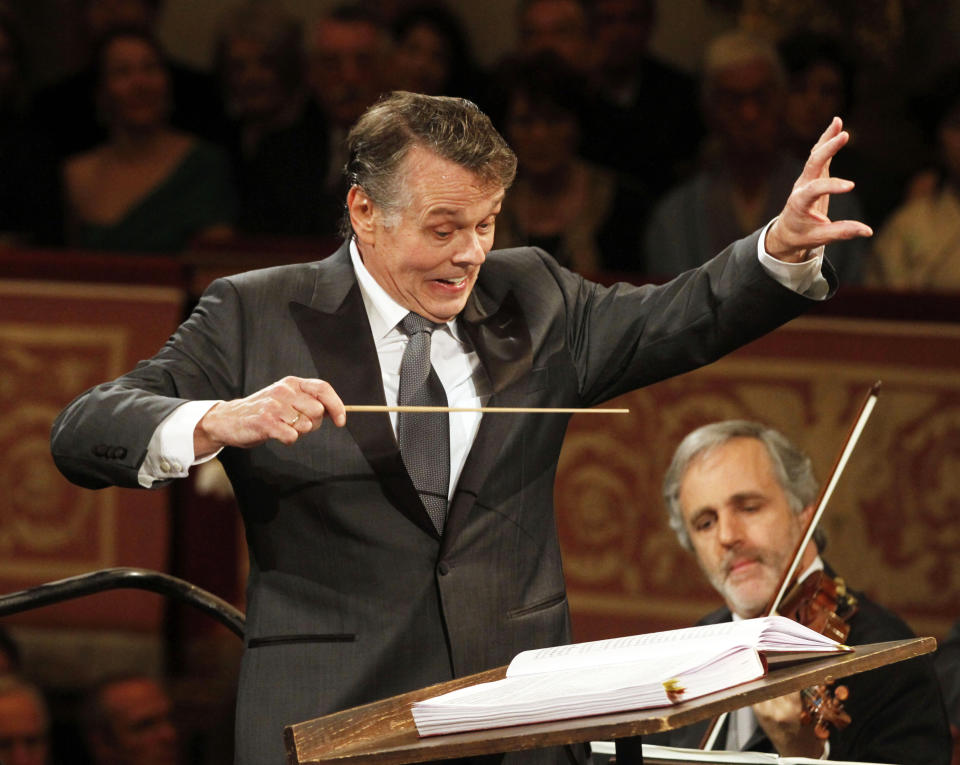 File---Picture taken Jan.1, 2012 shows Latvian conductor Mariss Jansons conducting the Vienna Philharmonic Orchestra during the traditional New Year's Concert at Vienna's Musikverein. Jansons died 76 years old. (AP Photo/Ronald Zak)