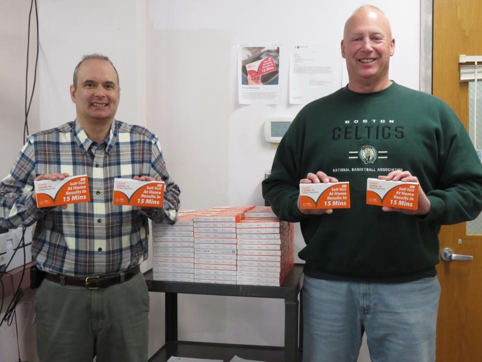 Winchendon Board of Health Agent James Abare, left, and BOH Chair Keith Kent display some of the newly received COVID-19 home antigen test kits received from the Massachusetts Executive Office of Health and Human Services. The kits are available free to Winchendon residents at the BOH office during normal business hours of operation.