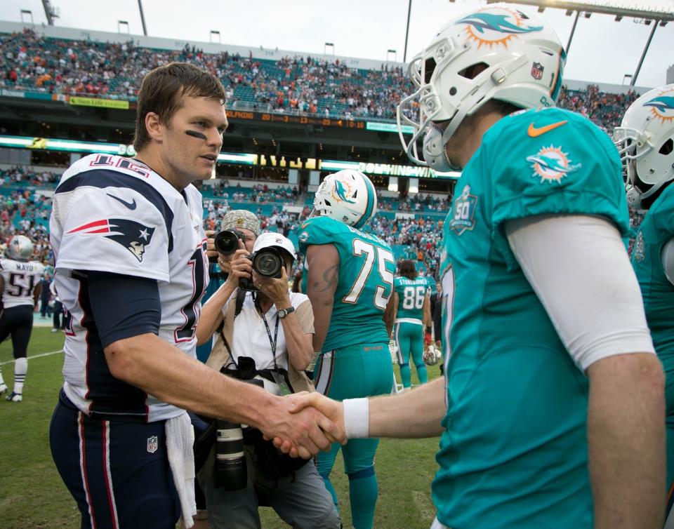 Patriots quarterback Tom Brady shakes hands with Dolphins quarterback Ryan Tannehill after the game on Jan. 3, 2016, in Miami Gardens, Fla.