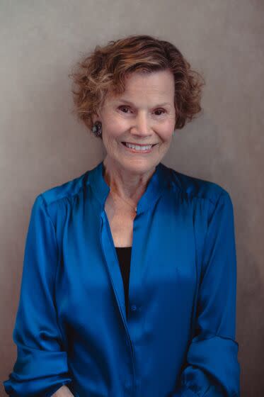 Author Judy Blume wears a blue blouse and smiles for a portrait