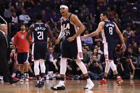 Dec 10, 2018; Phoenix, AZ, USA; LA Clippers forward Tobias Harris (34) celebrates on the court during the second half against the Phoenix Suns at Talking Stick Resort Arena. The LA Clippers won 123-119 in overtime. Jennifer Stewart-USA TODAY Sports