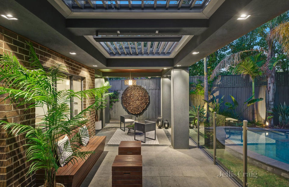 Outdoor dining area with a pool