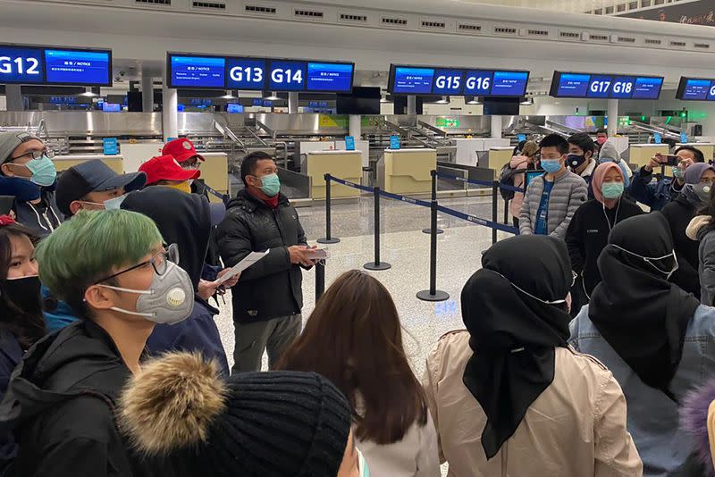 Indonesian citizens wait to be evacuated, ahead of departure to Indonesia at Tianhe International Airport, in Wuhan, Hubei