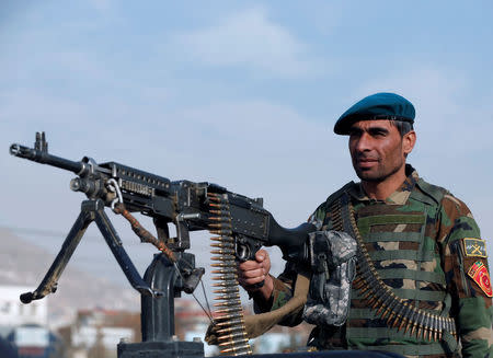 An Afghan National Army (ANA) soldier keeps watch at the site of an attack in Kabul, Afghanistan December 18, 2017. REUTERS/Omar Sobhani