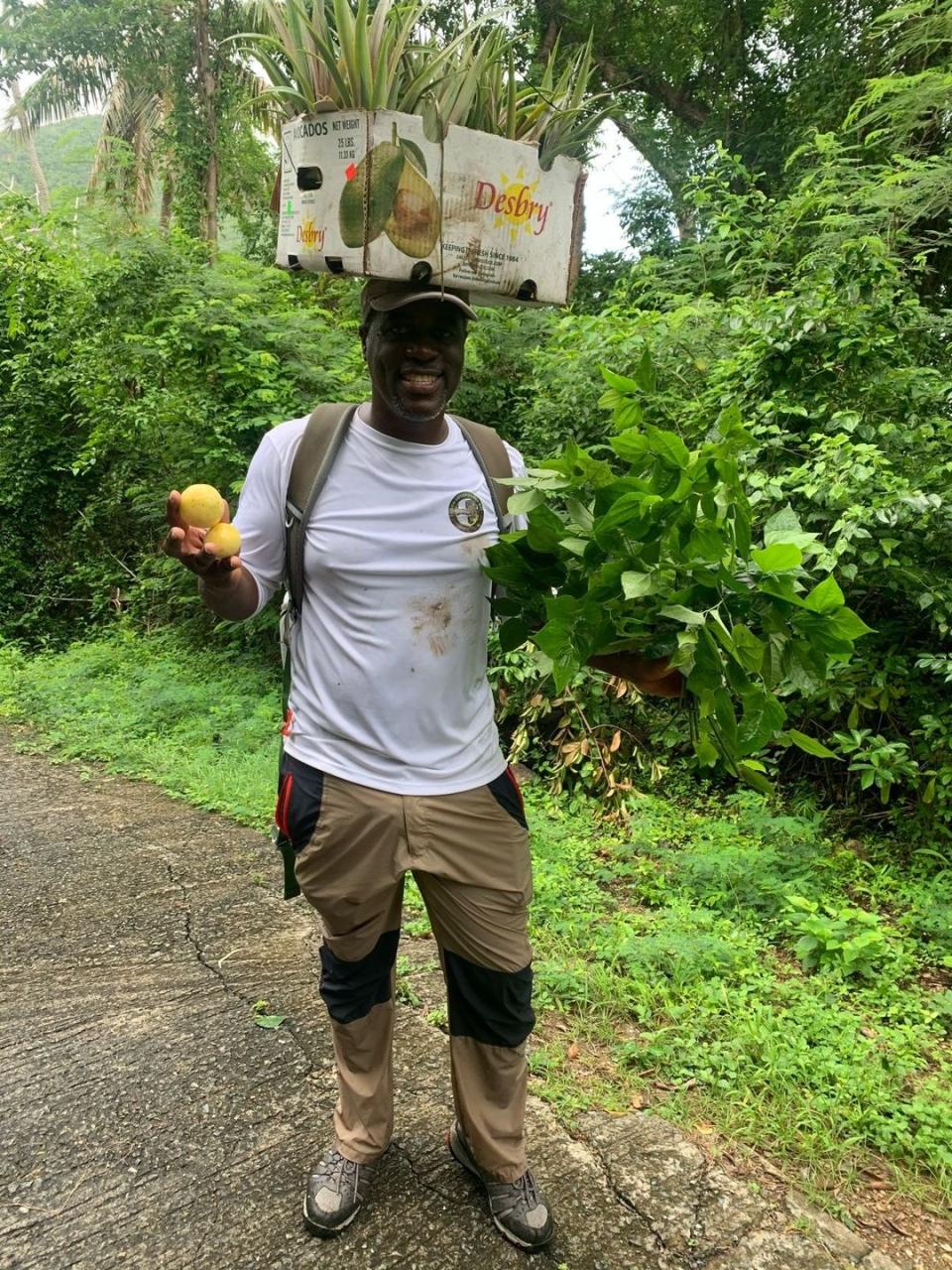 a man carrying a box on his head