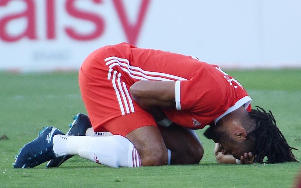 Ashley Williams grimaces in pain after injury against Mexico - Getty Images North America