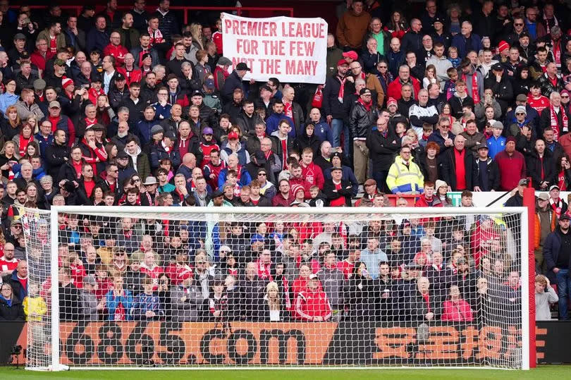 Nottingham Forest fans make a point by holding up a banner during the game against Manchester City at the City Ground