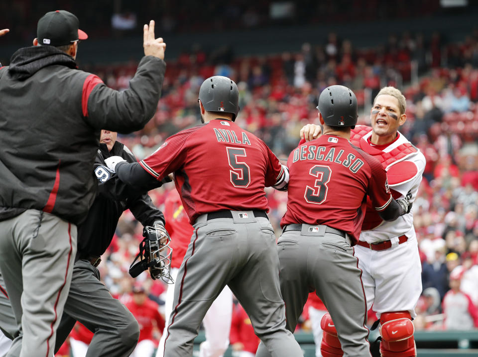 Yadier Molina and Torey Lovullo were suspended for their actions during an altercation. (AP Photo/Jeff Roberson)