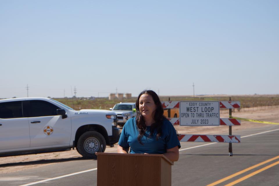 Eddy County Manager Roberta Gonzales speaks during a ribbon cutting ceremony for the West Loop Road on July 18, 2023.
