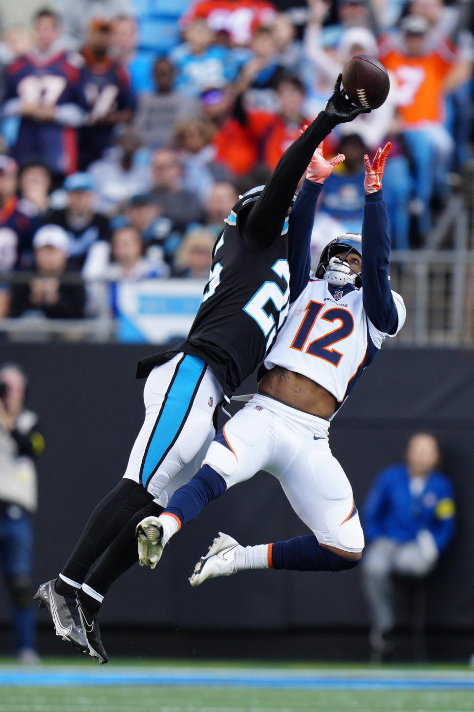 Carolina Panthers safety Xavier Woods breaks up a pass intended for Denver Broncos wide receiver Montrell Washington during the second half of an NFL football game between the Carolina Panthers and the Denver Broncos on Sunday, Nov. 27, 2022, in Charlotte, N.C. (AP Photo/Jacob Kupferman)