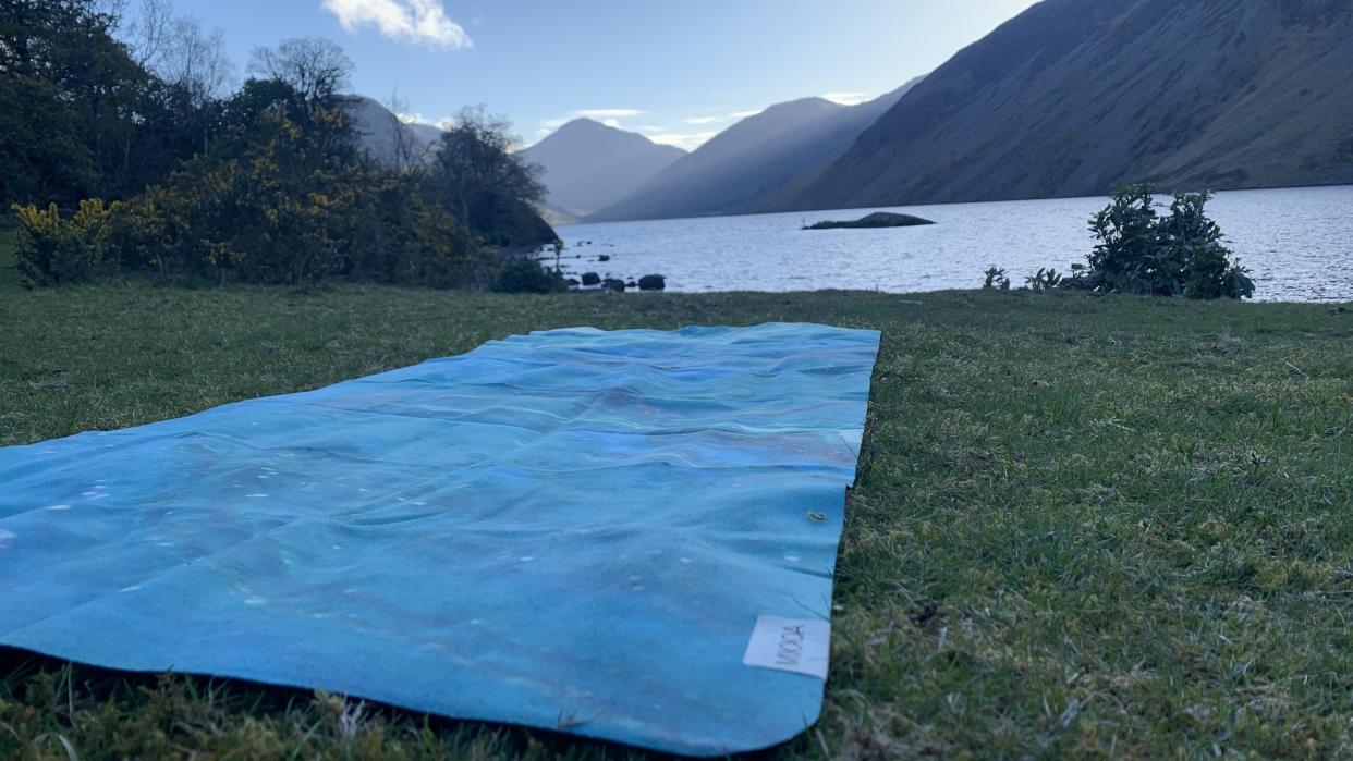  Yoga mat with lake in background. 