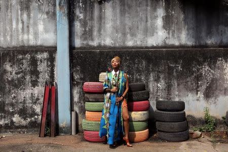 Singer Temi Dollface poses for a picture in the compound where she works from, in the Ikeja district of Lagos, Nigeria, May 18, 2016. REUTERS/Joe Penney