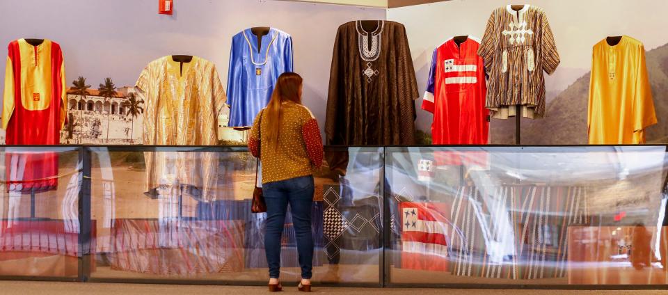 Susan Pellicciotti looks at dashikis, a West African garment, at the Isaac Hayes exhibit Thursday, April 14, 2022, at the Museum of Science & History in Memphis. The exhibit showcases Hayes' dashikis collection as well as his work in Ghana.