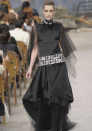 Chanel AW13 Couture: This quirky dress featured a jewelled belt and mesh sleeves.