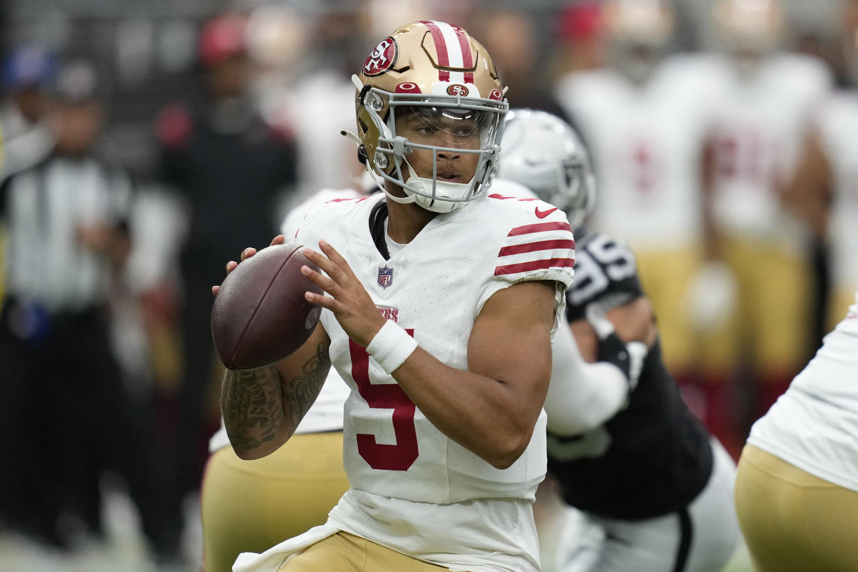 San Francisco 49ers quarterback Trey Lance (5) got the start against the Raiders in Sunday's preseason game. (AP Photo/John Locher)