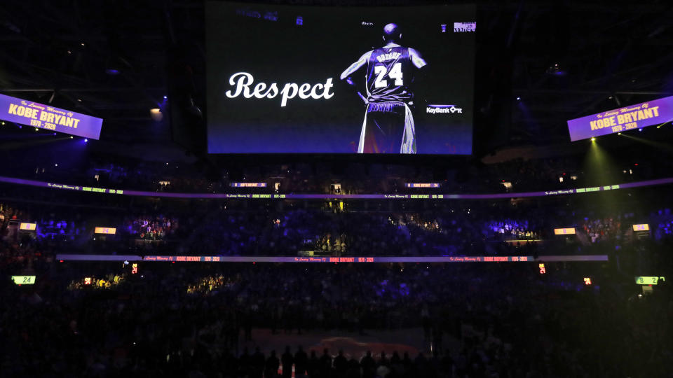 A tribute to Kobe Bryant is played during a moment of silence before an NBA basketball game between the Cleveland Cavaliers and the New Orleans Pelicans, Tuesday, Jan. 28, 2020, in Cleveland. (AP Photo/Tony Dejak)