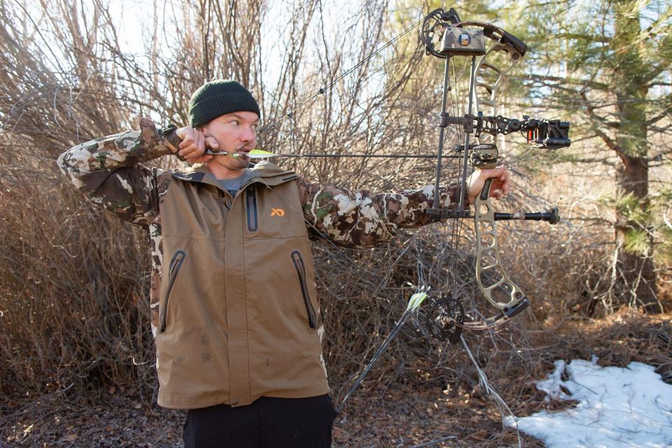 Two-time Olympic gold medal freeskier David Wise practices archery at his home in Verdi, Nev. near Reno on Wednesday, Jan. 12, 2022. 