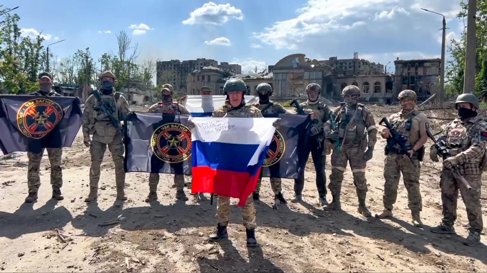 FILE - In this grab taken from video and released by Prigozhin Press Service Saturday, May 20, 2023, Yevgeny Prigozhin, the head of the Wagner Group military company speaks holding a Russian national flag in front of his soldiers in Bakhmut, Ukraine. Russia’s rebellious mercenary chief Yevgeny Prigozhin walked free from prosecution for his June 24 armed mutiny, and it’s still unclear if anyone will face any charges in the brief uprising against the military or for the deaths of the soldiers killed in it. (Prigozhin Press Service via AP, File)