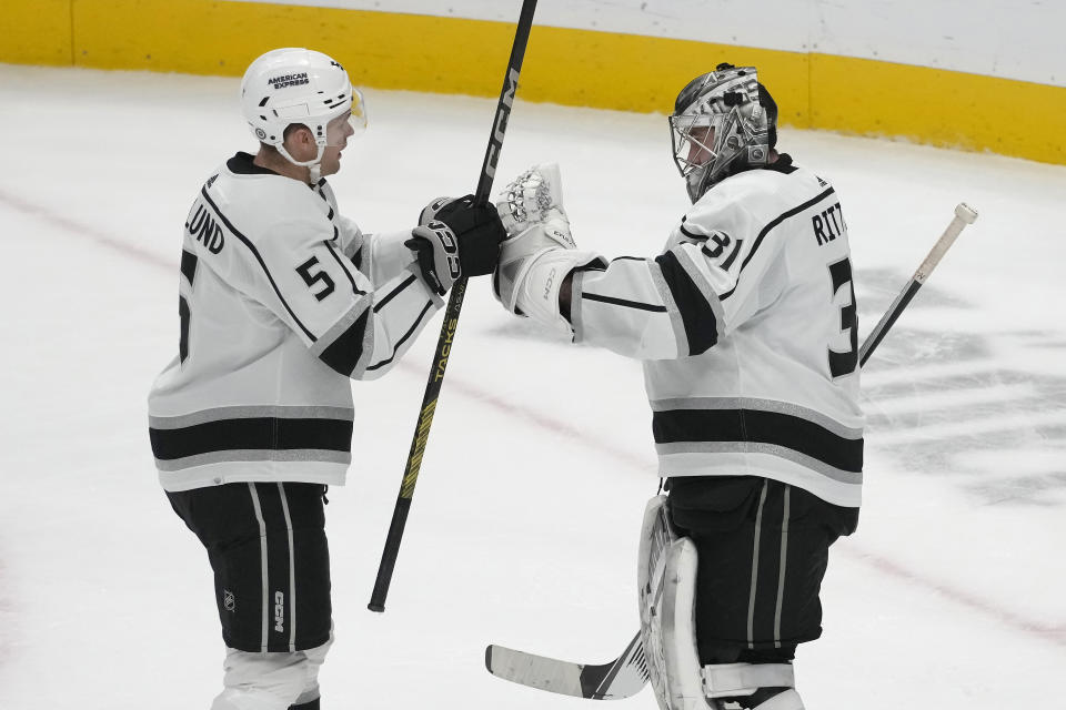 Los Angeles Kings defenseman Andreas Englund (5) and goaltender David Rittich (31) celebrate after the Kings defeated the San Jose Sharks in an NHL hockey game in San Jose, Calif., Tuesday, Dec. 19, 2023. (AP Photo/Jeff Chiu)