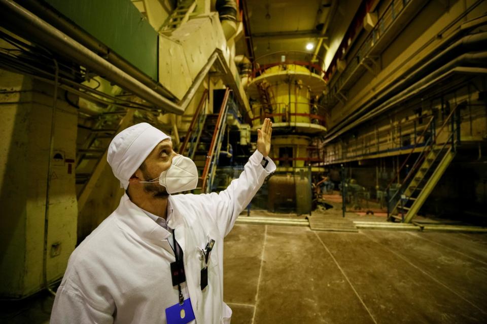 An employee is seen in a pump room of the stopped third reactor at the Chernobyl nuclear power plant in Chernobyl, Ukraine April 20, 2018.