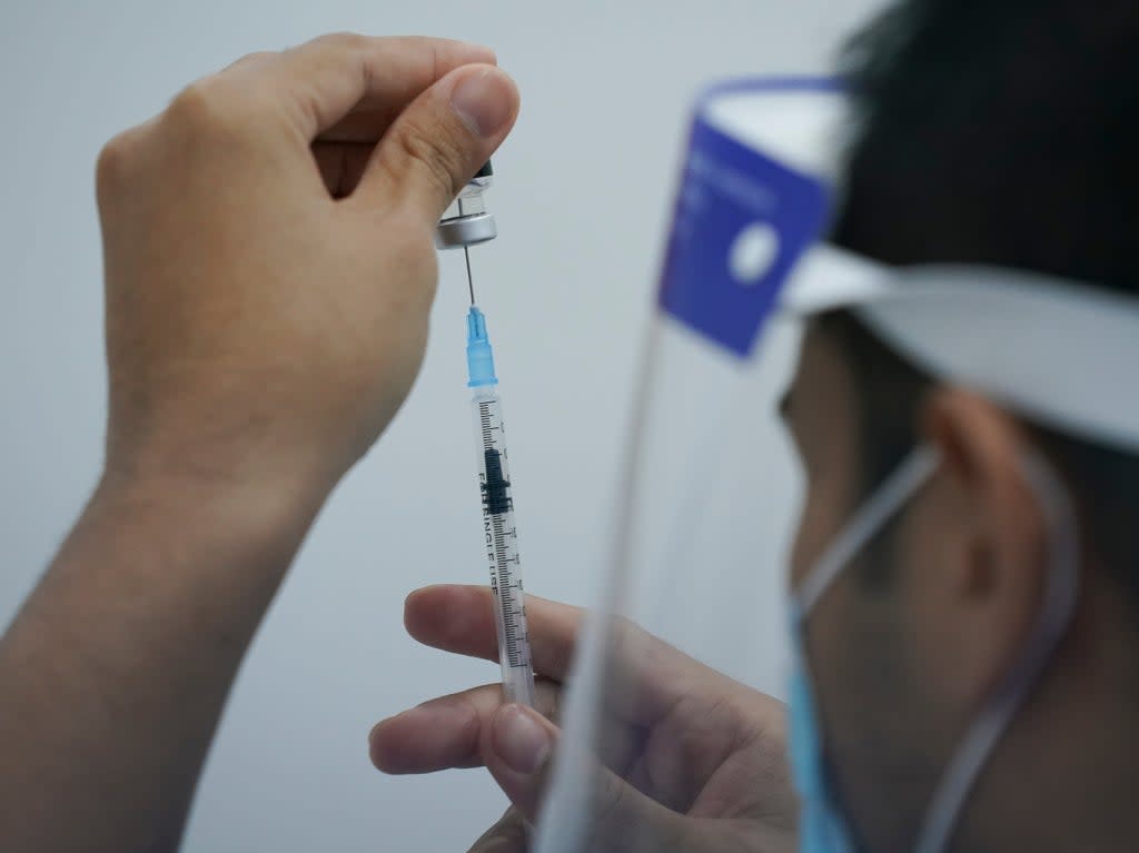 File photo: A health worker prepares to administer Pfizer’s Covid-19 vaccine at a vaccination center in Subang Jaya, Malaysia (AP)