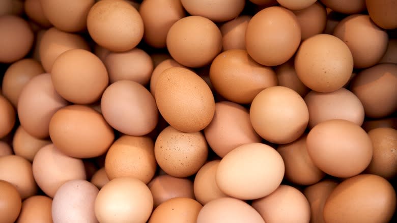 large pile of brown eggs