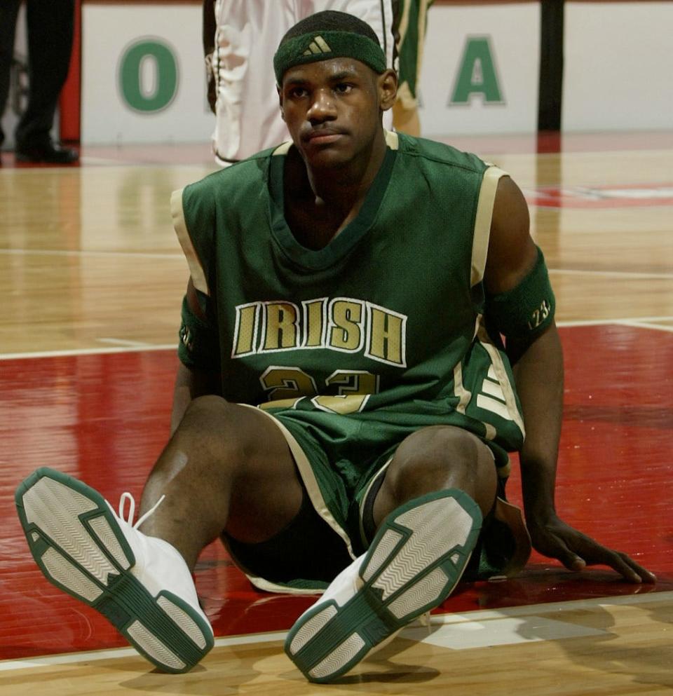 St. Vincent-St. Mary star LeBron James slips to the floor after working to get free under his goal in the Division II championship game against St. Bernard Roger Bacon at Value City Arena on March 23, 2002. James scored 32 points in the losing effort.