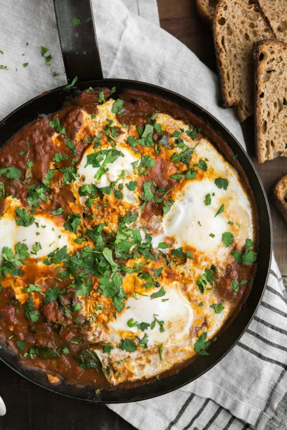 <strong>Get the <a href="https://naturallyella.com/curried-eggs-spinach/" target="_blank">Curried Eggs with Spinach recipe</a>&nbsp;from Naturally Ella</strong>