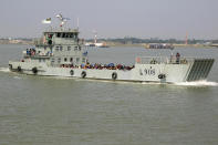 Rohingya refugees travel on a naval vessel that will take them to Bhasan Char island, in Chittagong, Bangladesh, Thursday, Nov. 25, 2012. Thousands have been relocated on the island in the Bay of Bengal from crammed camps near the Myanmar border. (AP Photo)