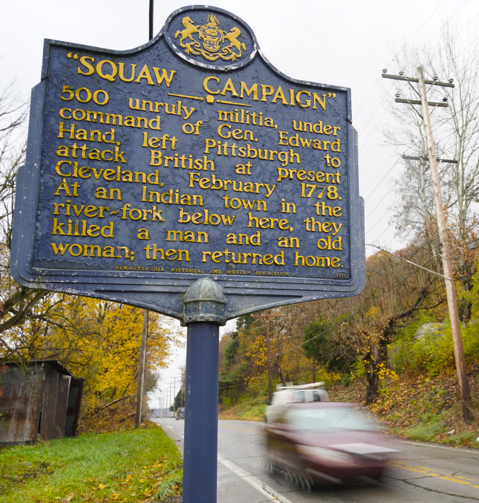 In this photo from Thursday, Nov. 18, 2021, a Pennsylvania Historical and Museum Commission plaque is seen along a roadside in New Castle, Pa. A recent review of all 2,500 markers the Pennsylvania Historical and Museum Commission had been installing for more than a century, faced a fresh round of questions about just whose stories were being told on the state's roadsides, and the language used to tell them. The increased scrutiny that has focused on factual errors, inadequate historical context and racist or otherwise inappropriate references, prompting the state to remove two markers, revise two and order new text for two others so far. The changes have become grist for the political mill. (AP Photo/Keith Srakocic)