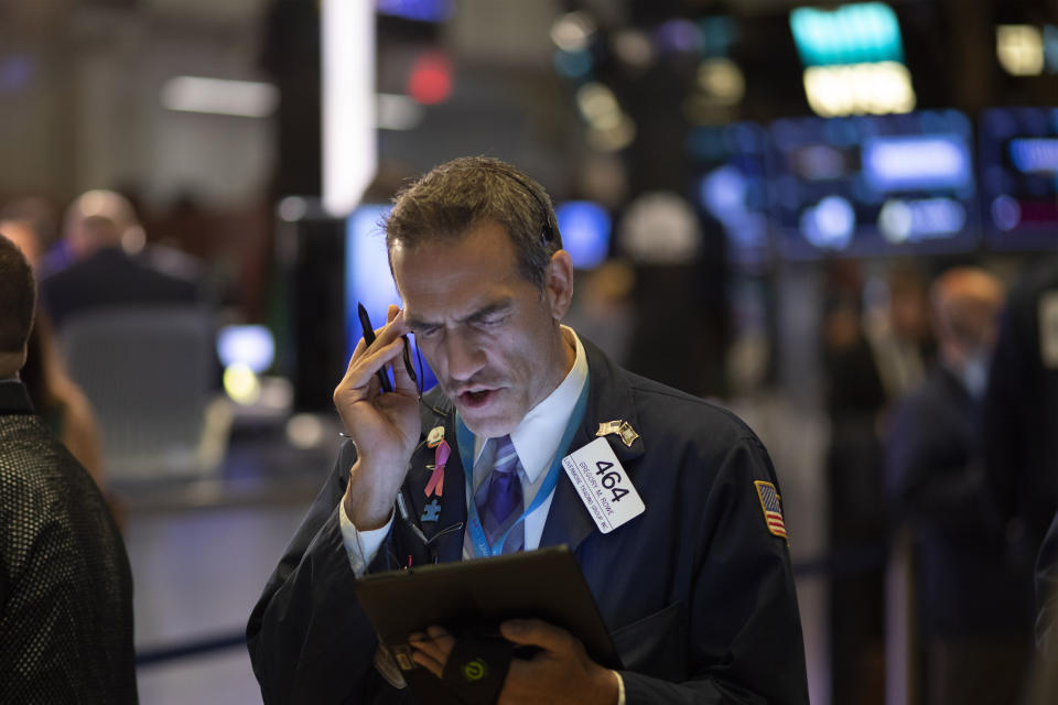 Stock trader Gregory Rowe works at the New York Stock Exchange, Wednesday, Sept. 18, 2019. The Federal Reserve is expected to announce its benchmark interest rate later in the day. (AP Photo/Mark Lennihan)