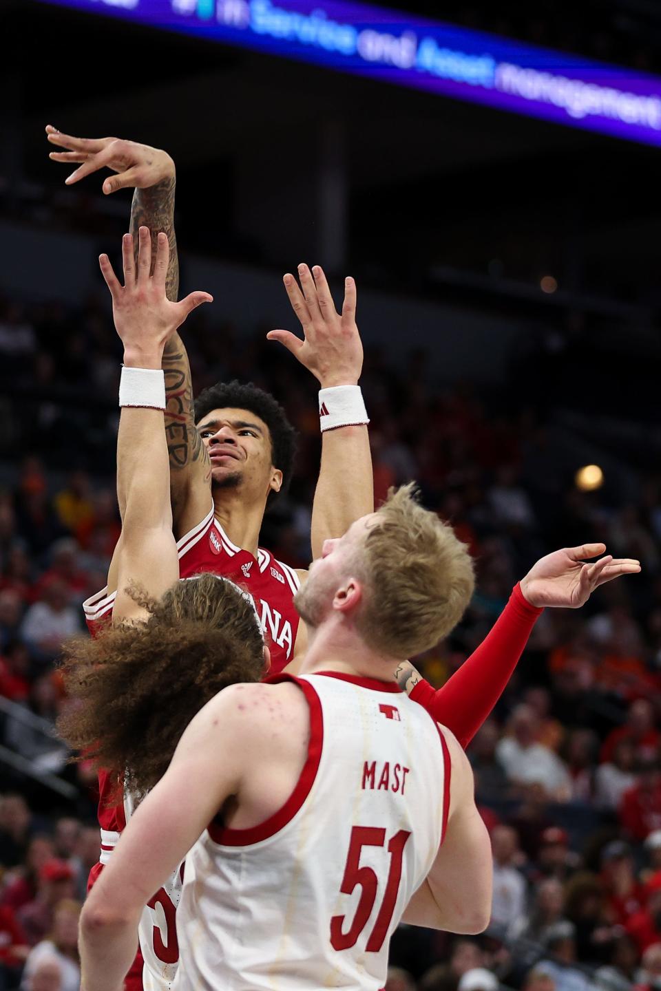 Mar 15, 2024; Minneapolis, MN, USA; Indiana Hoosiers center Kel'el Ware (1) shoots as Nebraska Cornhuskers forward Josiah Allick (53) and forward Rienk Mast (51) defend during the second half at Target Center. Mandatory Credit: Matt Krohn-USA TODAY Sports