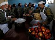 Afghan National Army (ANA) soldiers collect their lunch at the Kabul Military Training Centre (KMTC) in Kabul, Afghanistan October 23, 2016. REUTERS/Mohammad Ismail