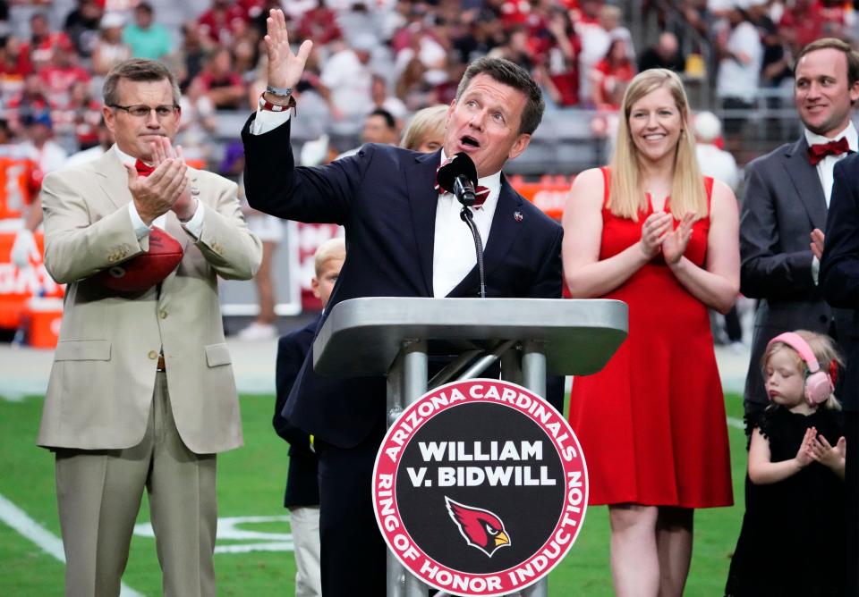 Sep 11, 2022; Glendale, Arizona, USA; Arizona Cardinals president Michael Bidwill honors his late father William V. Bidwill, the former owner of the Arizona Cardinals who was inducted into the Ring of Honor during a halftime ceremony at State Farm Stadium.