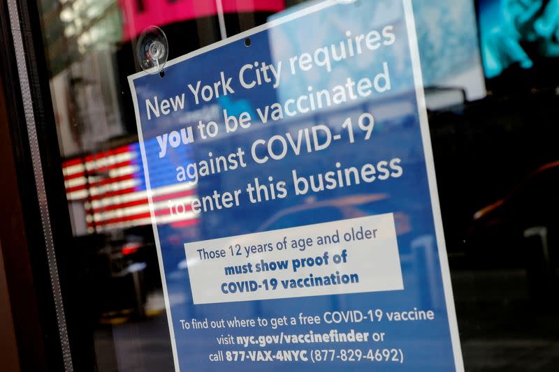 FILE PHOTO: Sign at restaurant requiring patrons to be vaccinated against COVID-19 in New York