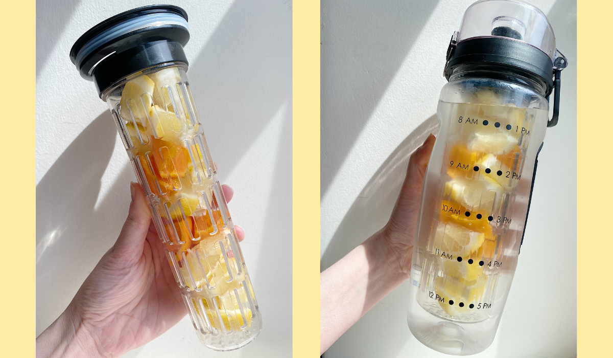 author holding the infuser filled with sliced fruit, and then holding the water bottle