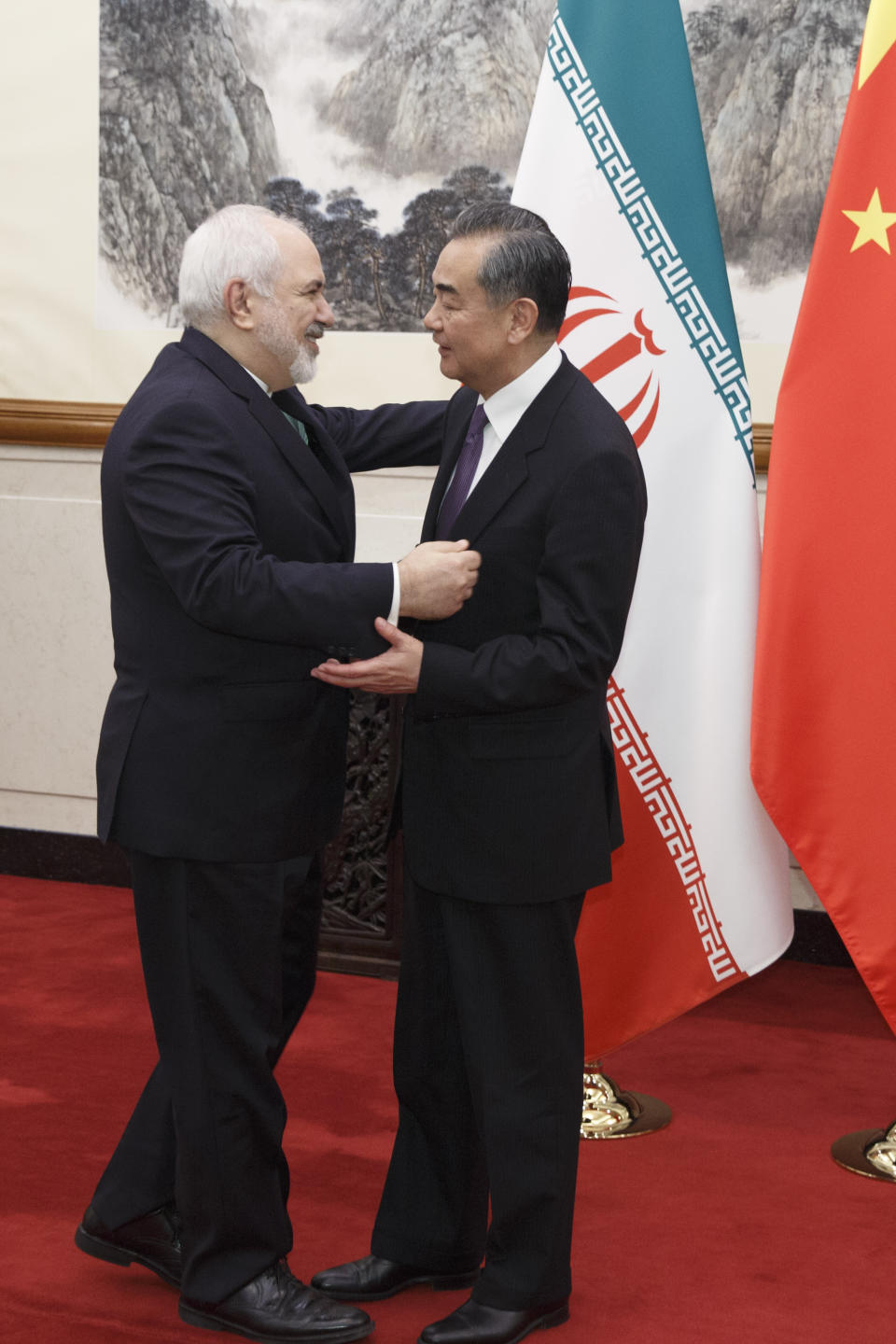 Chinese Foreign Minister Wang Yi, right, meets Iranian Foreign Minister Mohammad Javad Zarif at the Diaoyutai State Guesthouse in Beijing, Friday, May 17, 2019. (Thomas Peter/Pool Photo via AP)