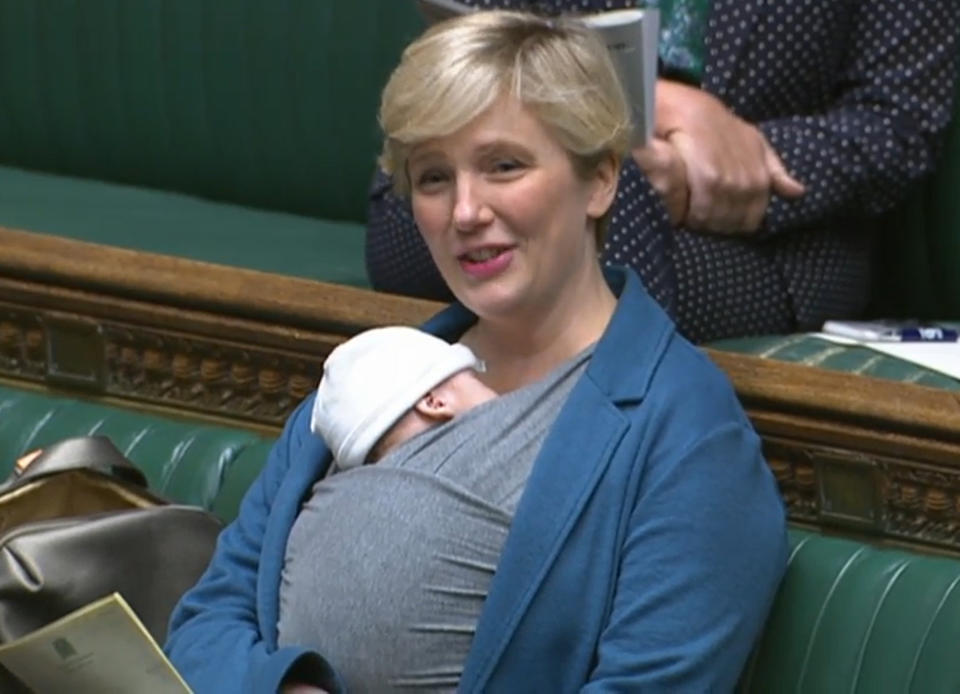 Labour MP Stella Creasy speaking in the chamber of the House of Commons, in London, with her newborn baby strapped to her.